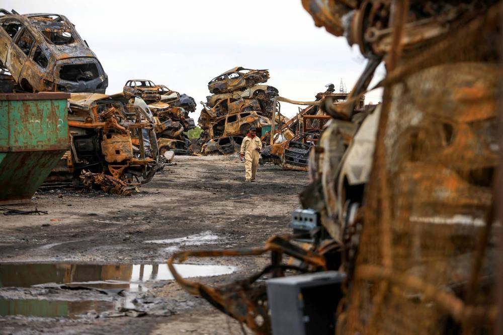 RUTH BONNEVILLE / FREE PRESS
The May 12 grass fire at 568 Gunn Rd. ripped through the yard and affected several other businesses in the area.