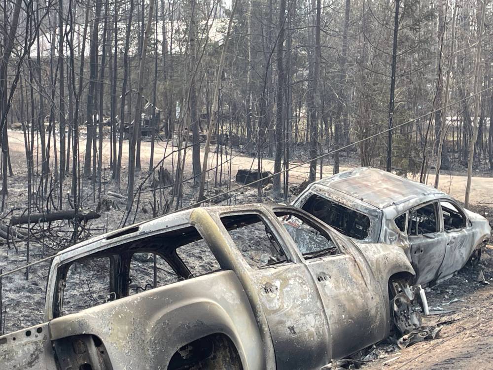 SUPPLIED
Burned-out vehicles remain along Wendigo Road in the aftermath of the fire.