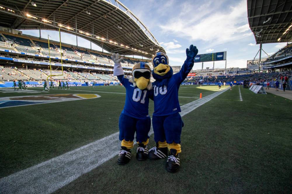 BROOK JONES/FREE PRESS The Winnipeg Blue Bombers host the visiting Saskatchewan Roughriders in Canadian Football league preseason action at Princess Auto Stadium in Winnipeg, Man., Saturday, May 24, 2025. The Bombers earned a 15-9 victory over the Riders. Pictured: Winnipeg Blue Bombers mascots Buzz (No. 01) and Boomer (No. 00) show their enthusiasm for the team’s win.