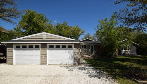 TODD LEWYS / FREE PRESS
                                Neat as a pin and exuding modern functionality, this 1,711 sq. ft. split level sits on a gorgeous park-like lot that’s surrounded by mature oak trees.
