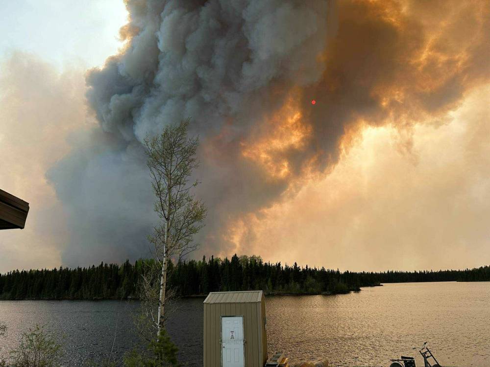 SUPPLIED
                         Sherridon residents were evacuated Sunday night. They were given a few hours to pack before charters came to take them from the region.