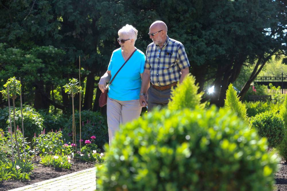 Ruth Bonneville / Free Press
Joan and Matthew Todd stroll through the freshly planted English Garden.