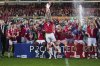 Wrexham's James McClean rises the trophy as they win the English League One soccer match between Wrexham and Charlton Athletic at the Racecourse ground in Wrexham, Wales, Saturday, April 26, 2025. (AP Photo/Jon Super)