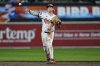 Baltimore Orioles second baseman Jackson Holliday (7) throws a ground ball hit in by St. Louis Cardinals' Willson Contreras to first baseman Ryan Mountcastle for the out at first base during the ninth inning of a baseball game, Tuesday, May 27, 2025, in Baltimore. (AP Photo/Stephanie Scarbrough)