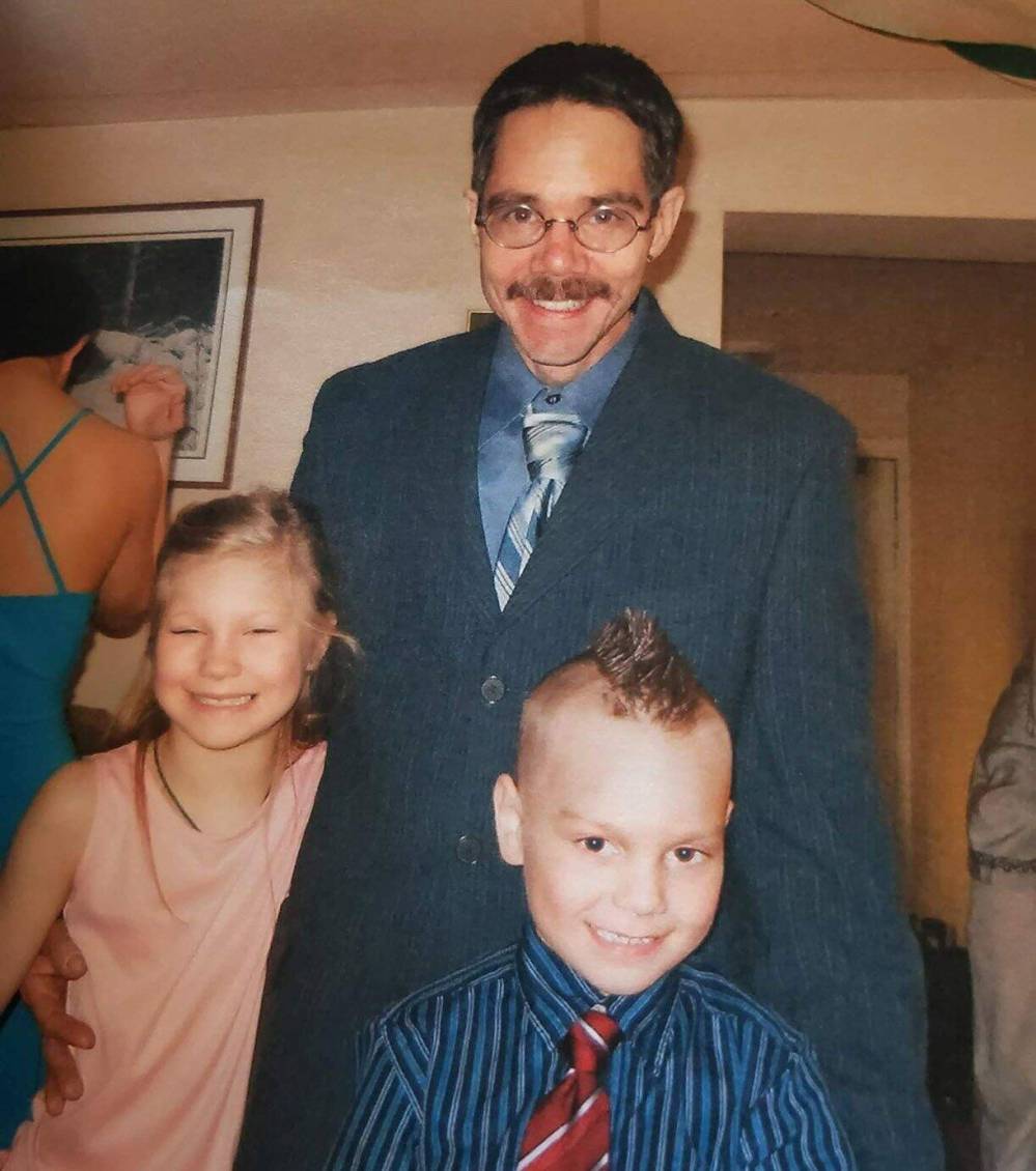 SUPPLIED Bud Paul poses with his grandchildren, Myeesha (left) and Dade, on his wedding day.