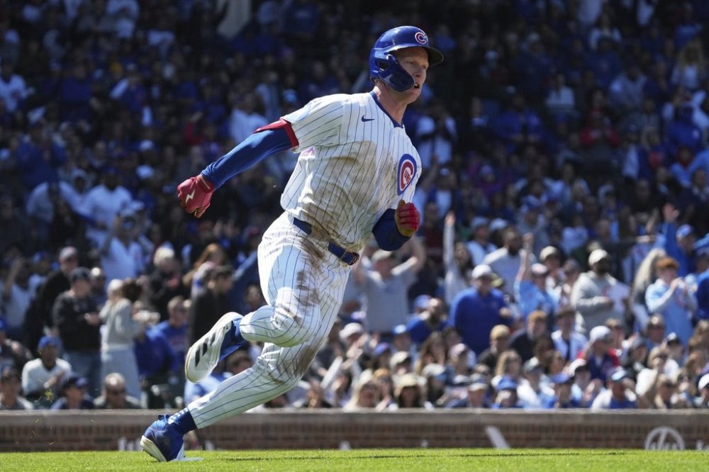 Chicago Cubs' Pete Crow-Armstrong runs after hitting a one-run double during the sixth inning of a baseball game against the Chicago White Sox in Chicago, Sunday, May 18, 2025. (AP Photo/Nam Y. Huh)