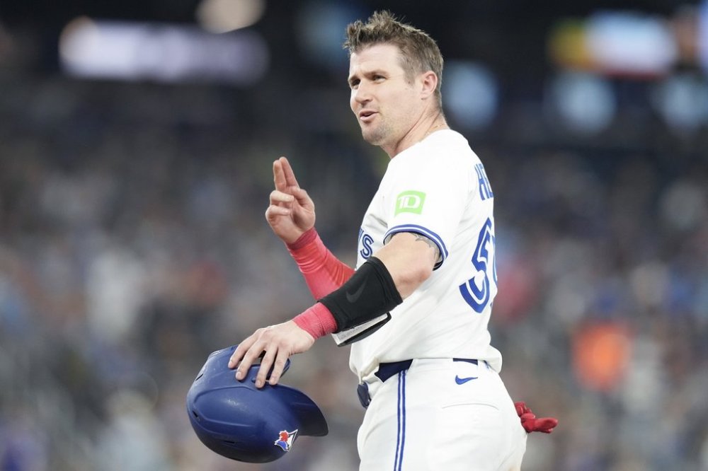 Blue Jays catcher Tyler Heineman gestures toward the Philadelphia dugout after hitting a two-run RBI single off pitcher Jesus Luzardo (44) during the third inning of a Major League Baseball game in Toronto on Thursday, June 5, 2025. THE CANADIAN PRESS/Chris Young
