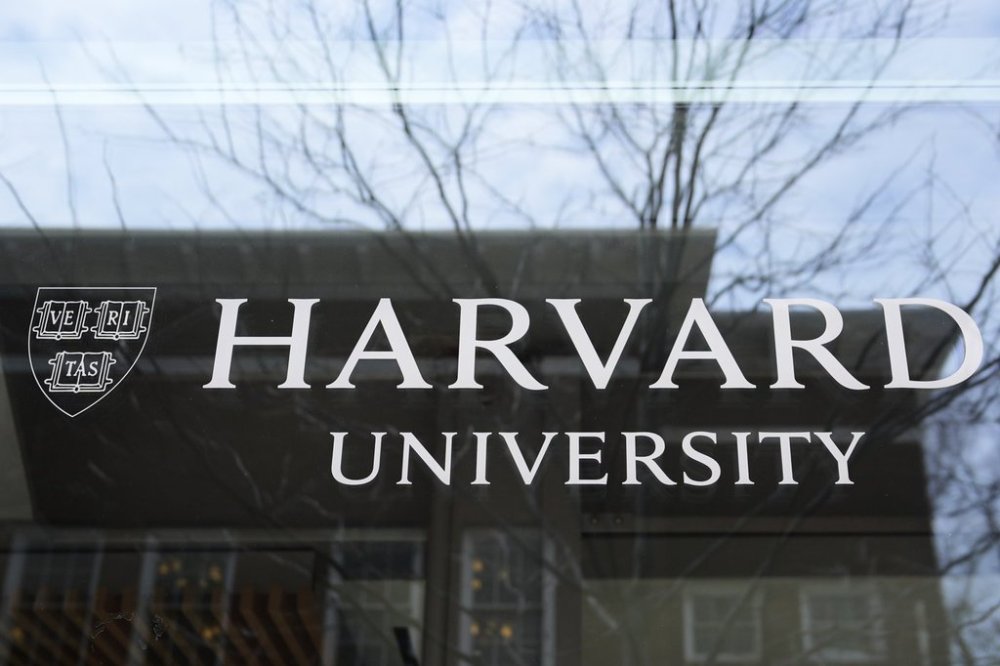 The Harvard University logo is displayed on a building at the school, Tuesday, April 15, 2025, in Cambridge, Mass. (AP Photo/Charles Krupa)