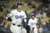 Los Angeles Dodgers' Shohei Ohtani jogs back to the dugout after grounding out during the eighth inning of a baseball game against the Arizona Diamondbacks in Los Angeles, Monday, May 19, 2025. (AP Photo/Kyusung Gong)