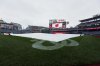 The tarp covers the infield at Nationals Park before the baseball game between the Washington Nationals and the Atlanta Braves was postponed because of the weather, Wednesday, May 21, 2025, in Washington. (AP Photo/Daniel Kucin Jr.)