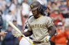 San Diego Padres' Connor Joe flips his bat after striking out to end the baseball game against the Detroit Tigers, Wednesday, April 23, 2025, in Detroit. (AP Photo/Duane Burleson)