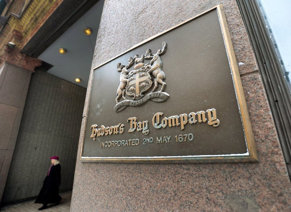 A women leaves the downtown Toronto flagship Hudson Bay Company store in Toronto on Monday, January 27, 2014. THE CANADIAN PRESS/Nathan Denette