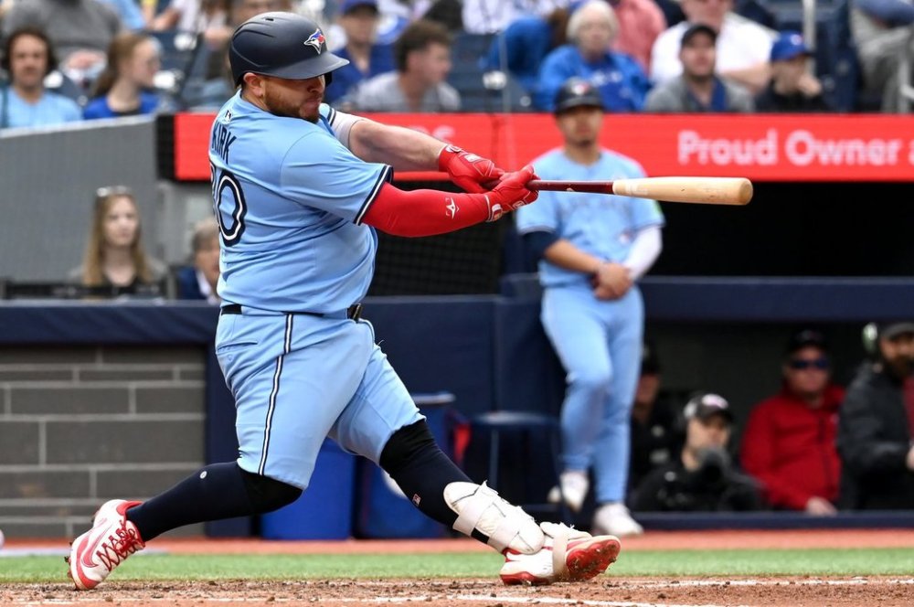Toronto Blue Jays catcher Alejandro Kirk (30) hits an RBI double against the Athletics in fifth inning MLB baseball action in Toronto on Sunday, June 1, 2025. THE CANADIAN PRESS/Jon Blacker