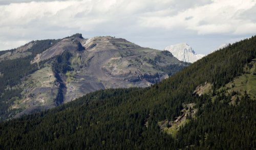 Grassy Mountain, peak to left, and the Grassy Mountain Coal Project are seen north of Blairmore, Alta., Thursday, June 6, 2024. THE CANADIAN PRESS/Jeff McIntosh