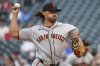 San Francisco Giants pitcher Jordan Hicks (12) throws to the Minnesota Twins during the first inning of a baseball game Friday, May 9, 2025, in Minneapolis. (AP Photo/Ellen Schmidt)