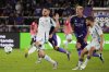 Chicago Fire forward Hugo Cuypers (9) moves the ball past Orlando City defender David Brekalo (4) and defender Robin Jansson, second from right, during the second half of an MLS soccer match, Saturday, May 31, 2025, in Orlando, Fla. (AP Photo/John Raoux)