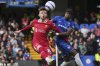Liverpool's Conor Bradley, left, and Chelsea's Noni Madueke vie for the ball during the English Premier League soccer match between Chelsea and Liverpool at Stamford Bridge stadium in London, Sunday, May 4, 2025. (AP Photo/Kin Cheung)
