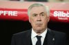 Real Madrid's head coach Carlo Ancelotti waits for the start of the Spanish Copa del Rey final soccer match between Barcelona and Real Madrid at Estadio de La Cartuja stadium in Seville, Spain, Saturday, April 26, 2025. (AP Photo/Jose Breton)