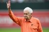 FILE - Jim Henneman waves before throwing out a ceremonial first pitch before a baseball game between the Baltimore Orioles and the Oakland Athletics, April 27, 2024, in Baltimore. (AP Photo/Nick Wass, File)