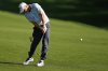 Alex Noren, of Sweden, hits from the fairway on the 18th hole during the third round of the PGA Championship golf tournament at the Quail Hollow Club, Saturday, May 17, 2025, in Charlotte, N.C. (AP Photo/Matt York)