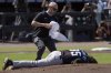 A Miami Marlins trainer rushes out to help pitcher Ryan Weathers after he was hit in the head while teammates were warming up before the first inning of a baseball game Saturday, June 7, 2025, in Tampa, Fla. (AP Photo/Chris O'Meara)
