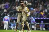 San Diego Padres closing pitcher Robert Suarez celebrates a win against the Colorado Rockies with catcher Martín Maldonado (15) following the ninth inning of a baseball game Friday, May 9, 2025, in Denver. (AP Photo/Jack Dempsey)