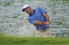 Scottie Scheffler hits out of a bunker on the 18th hole during the first round of the Charles Schwab Challenge golf tournament at Colonial Country Club in Fort Worth, Texas, Thursday, May 22, 2025. (AP Photo/LM Otero)