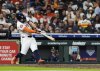 Houston Astros' Jose Altuve hits a home run during the fifth inning of a baseball game against the Seattle Mariners in Houston, Thursday, May 22, 2025. (AP Photo/Ashley Landis)