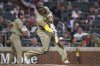 San Diego Padres' Manny Machado hits a home run in the ninth inning of a baseball game against the Atlanta Braves, Friday, May 23, 2025, in Atlanta. (AP Photo/Colin Hubbard)