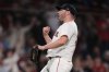 Boston Red Sox pitcher Liam Hendriks celebrates after the final out of a baseball game against the Minnesota Twins at Fenway Park, Friday, May 2, 2025, in Boston. (AP Photo/Charles Krupa)