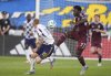 Colorado Rapids forward Darren Yapi, right, passes the ball as Real Salt Lake defender Justen Glad, left, covers in the first half of an MLS soccer match Saturday, May 17, 2025, in Commerce City, Colo. (AP Photo/David Zalubowski)