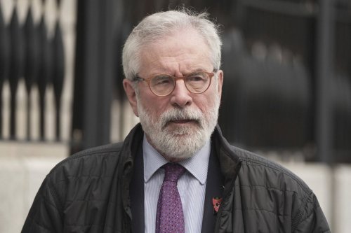 Former Sinn Fein president Gerry Adams walks outside the High Court where he is bringing a legal action against the BBC over allegations about the murder of an MI5 spy in 2006,in Dublin, Ireland, Wednesday May 28, 2025. (Brian Lawless/PA via AP)