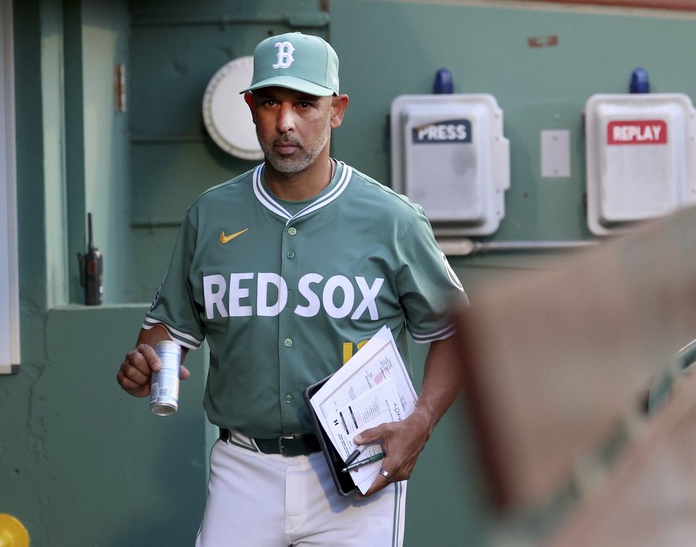 Boston Red Sox manager Alex Cora enters the dugout before a baseball game against the Atlanta Braves, Friday, May 16, 2025, in Boston. (AP Photo/Mark Stockwell)