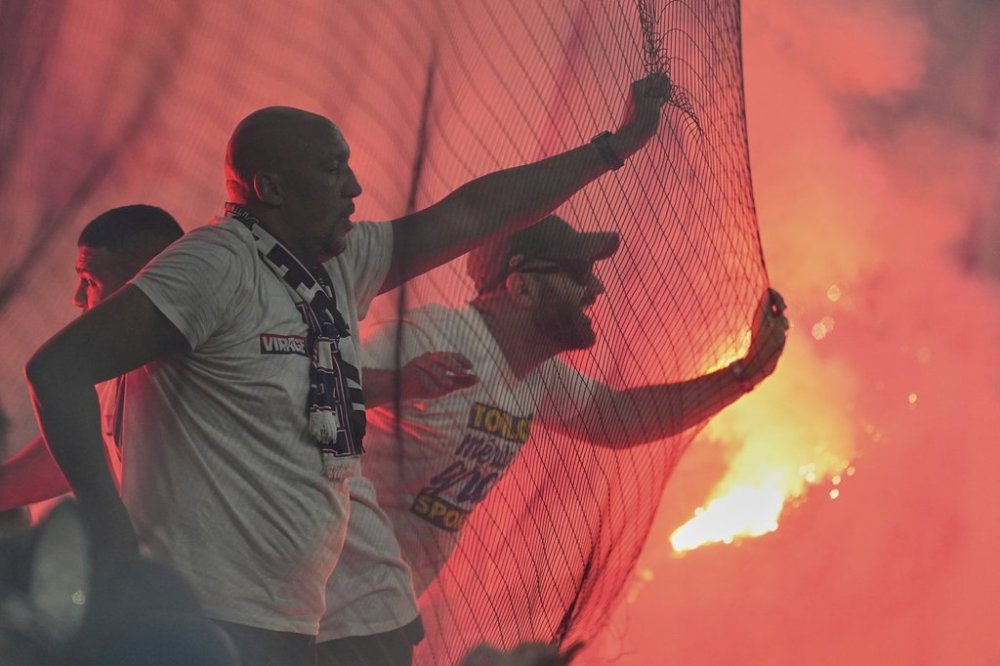 PSG fans celebrate after PSG's Achraf Hakimi scores his side's opening goal during the Champions League final soccer match between Paris Saint-Germain and Inter Milan at the Allianz Arena in Munich, Germany, Saturday, May 31, 2025. (AP Photo/Martin Meissner)