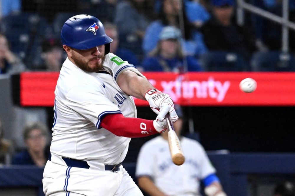 Toronto Blue Jays catcher Alejandro Kirk (30) hits a three run home run against the Tampa Bay Rays in sixth inning American League baseball action in Toronto on Wednesday, May 14, 2025. THE CANADIAN PRESS/Jon Blacker