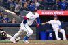 Toronto Blue Jays left fielder Jonatan Clase hits a single against the Detroit Tigers in fifth inning American League baseball action in Toronto on Sunday, May 18, 2025. THE CANADIAN PRESS/Jon Blacker