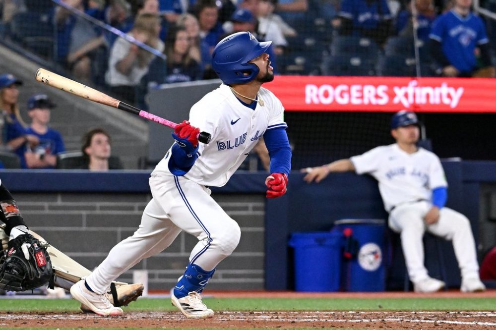Toronto Blue Jays left fielder Jonatan Clase hits a single against the Detroit Tigers in fifth inning American League baseball action in Toronto on Sunday, May 18, 2025. THE CANADIAN PRESS/Jon Blacker