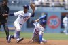New York Mets' Tyrone Taylor (15) steals second base against Los Angeles Dodgers shortstop Mookie Betts (50) during the second inning of a baseball game Thursday, June 5, 2025, in Los Angeles. (AP Photo/Jae C. Hong)