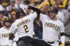 San Diego Padres' Xander Bogaerts (2) celebrates with teammates after hitting a three-run home run during the first inning of a baseball game against the Los Angeles Angels Wednesday, May 14, 2025, in San Diego. (AP Photo/Gregory Bull)