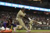 San Diego Padres' Manny Machado hits a two-run single during the ninth inning of a baseball game against the San Francisco Giants, Tuesday, June 3, 2025, in San Francisco. (AP Photo/Godofredo A. Vásquez)