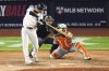 New York Yankees' Cody Bellinger hits a grand slam home run during the eighth inning of a baseball game against the New York Mets Sunday, May 18, 2025, in New York. (AP Photo/Frank Franklin II)