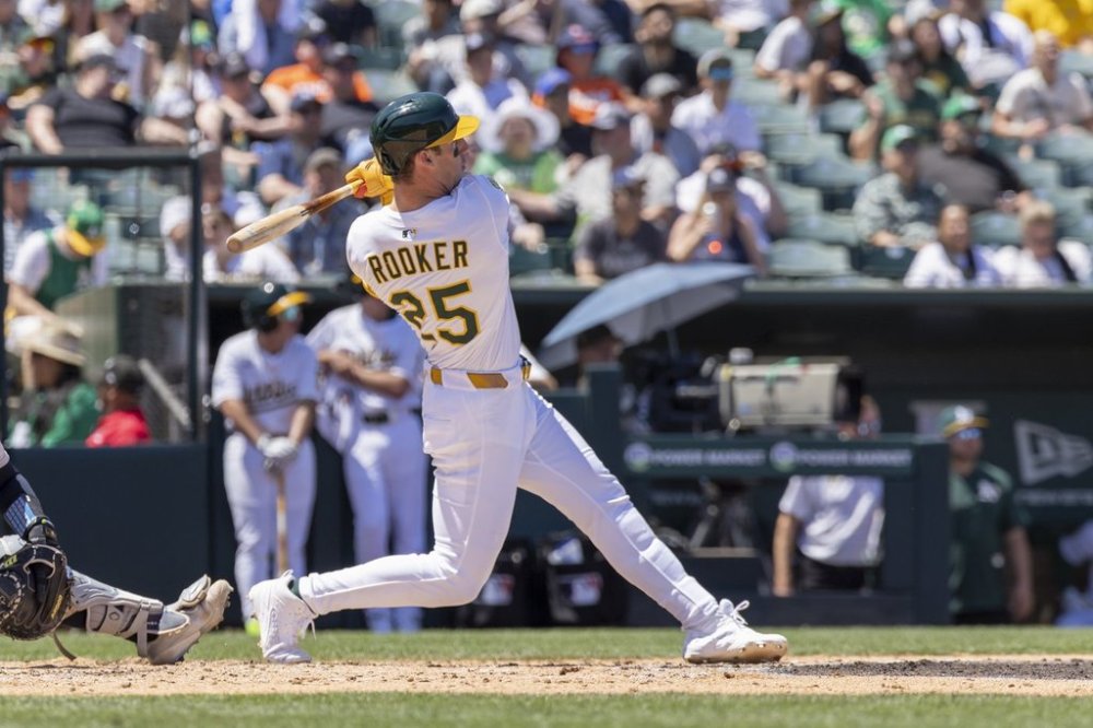 Athletics' Brent Rooker (25) hits a two-run home run during the third inning of a baseball game against the New York Yankees, Saturday, May 10, 2025, in West Sacramento, Calif. (AP Photo/Sara Nevis)