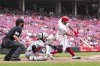 Cincinnati Reds' Christian Encarnacion-Strand (33) hits the game-winning RBI double during the 10th inning of a baseball game against the Arizona Diamondbacks that was suspended Friday because of rain and resumed, Saturday, June 7, 2025, in Cincinnati. (AP Photo/Jeff Dean)