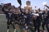 The Bologna team celebrates with the Italian Cup won last week at the end of the Serie A soccer match between Bologna and Genoa, at the Renato Dall'Ara Stadium, in Bologna, Italy, Saturday, May 24, 2025. (Michele Nucci/LaPresse via AP)
