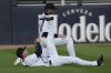 Chicago White Sox's Austin Slater, bottom, and Tim Elko warm up before a baseball game against the Seattle Mariners in Chicago, Monday, May 19, 2025. (AP Photo/Nam Y. Huh)