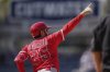 Los Angeles Angels' Travis d'Arnaud gestures after hitting a solo home run during the eighth inning of a baseball game against the Los Angeles Dodgers, Sunday, May 18, 2025, in Los Angeles. (AP Photo/Mark J. Terrill)