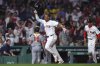 Boston Red Sox's Rafael Devers, left, celebrates as he runs the bases toward home after hitting a walkoff home run in the ninth inning of a baseball game against the Atlanta Braves, Saturday, May 17, 2025, in Boston. (AP Photo/Steven Senne)