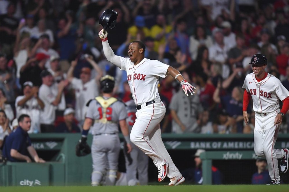 Boston Red Sox's Rafael Devers, left, celebrates as he runs the bases toward home after hitting a walkoff home run in the ninth inning of a baseball game against the Atlanta Braves, Saturday, May 17, 2025, in Boston. (AP Photo/Steven Senne)