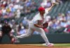 Philadelphia Phillies starting pitcher Ranger Suarez throws to the plate during the first inning of a baseball game against the Colorado Rockies, Thursday, May 22, 2025, in Denver. (AP Photo/Jack Dempsey)