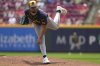 Milwaukee Brewers' DL Hall follows through on a pitch in the second inning of a baseball game against the Cincinnati Reds, Wednesday, June 4, 2025, in Cincinnati. (AP Photo/Kareem Elgazzar)